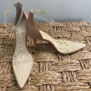 Jessica Simpson nude and clear with studded strap, pointed heel.
